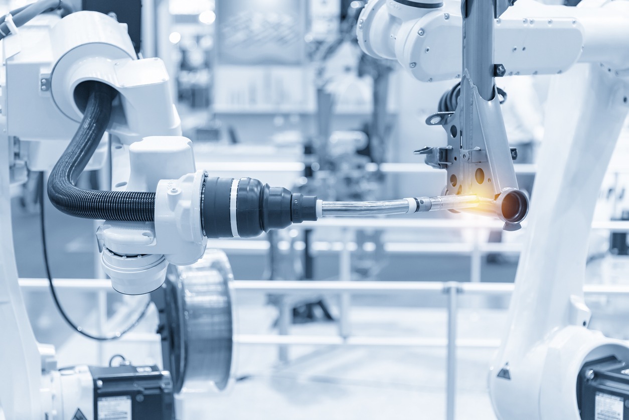 The robotics arm welding the automotive parts.