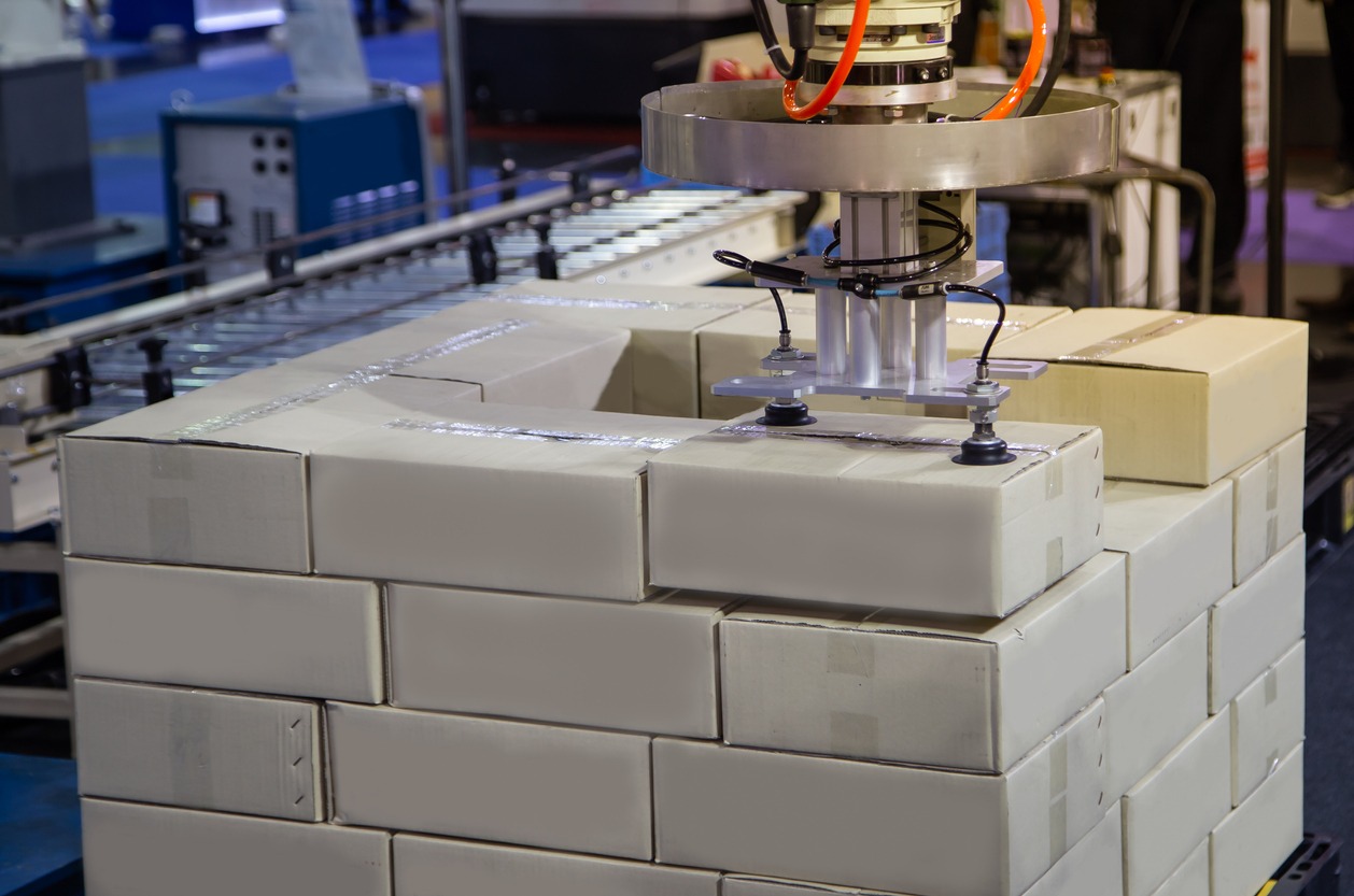 Robot arm loading in a factory