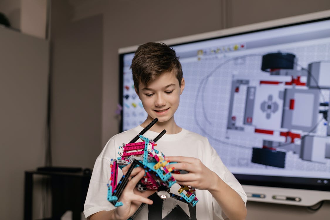 boy holding his robot
