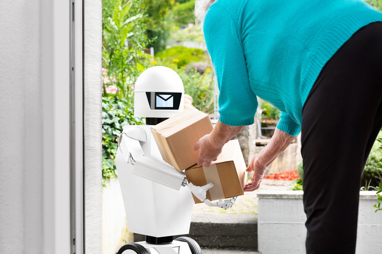 autonomous ai artificial intelligence robot is delivering parcels or boxes, senior woman is receiving post from an futuristic robotic delivery service