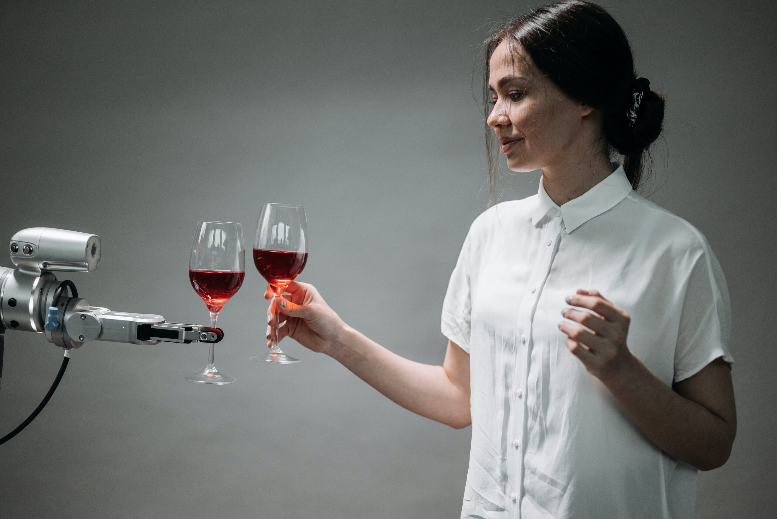 a robot holding a wine