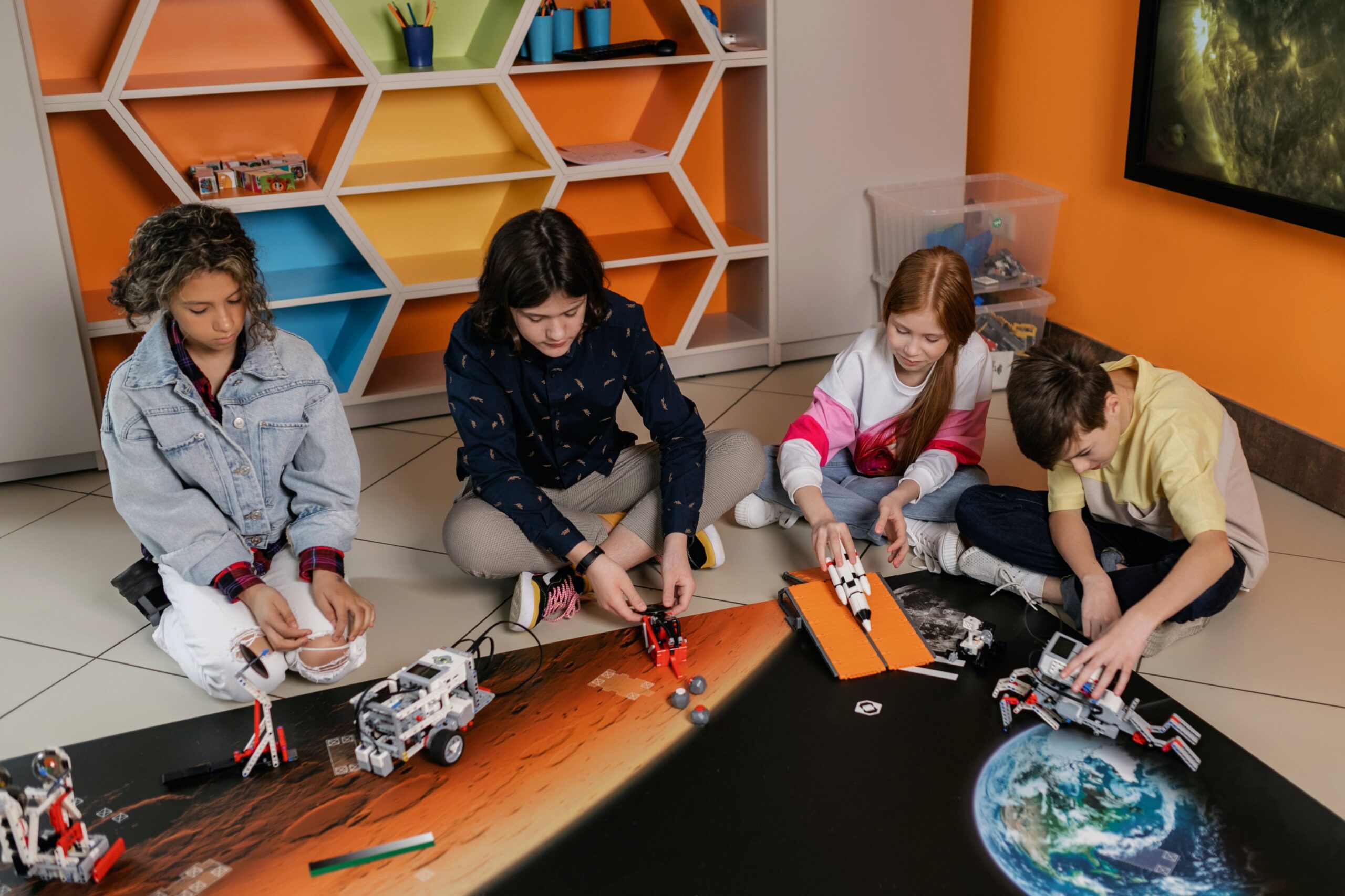 adolescent people building robots